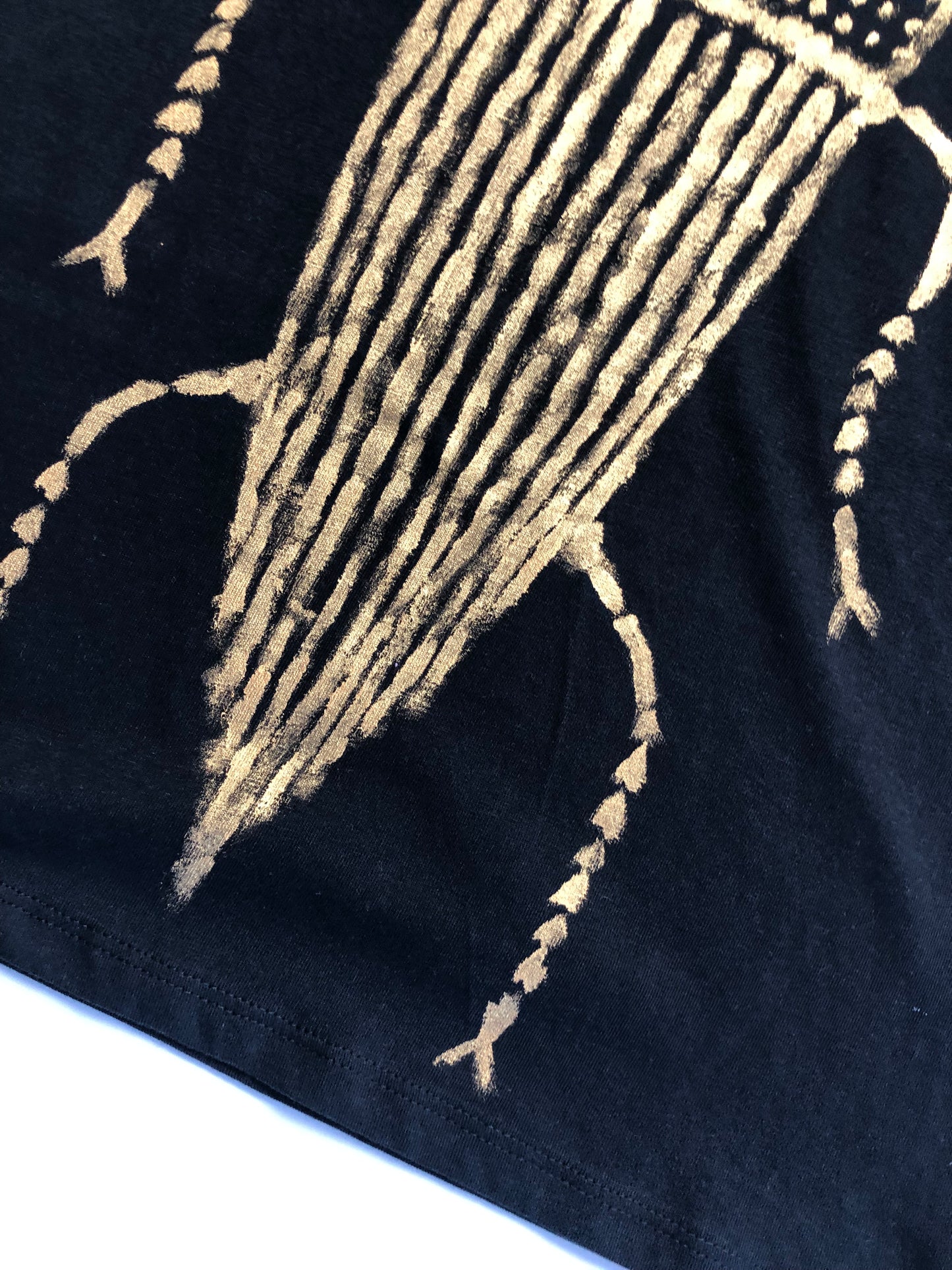 Women's short sleeve t-shirt pattern details gold cockroach