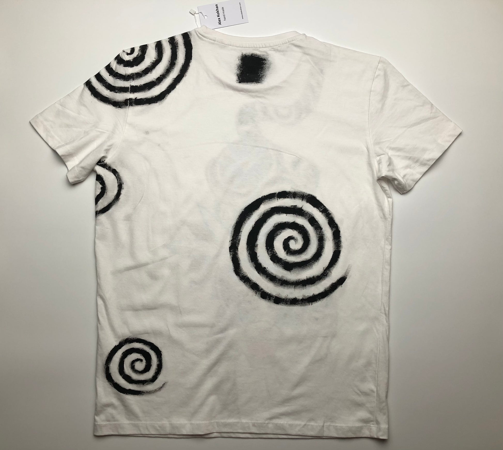 The reverse side of a men's T-shirt with a handmade pattern