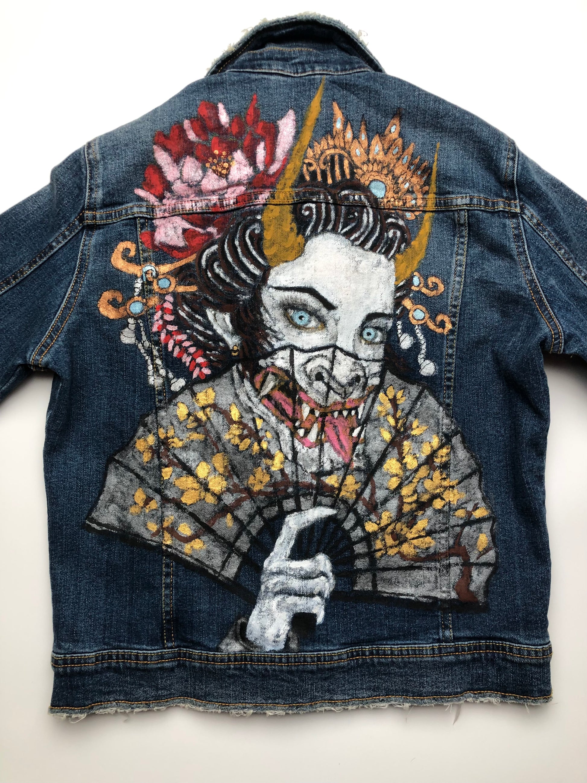 Beautiful drawing of a demon on an elite women's denim jacket
