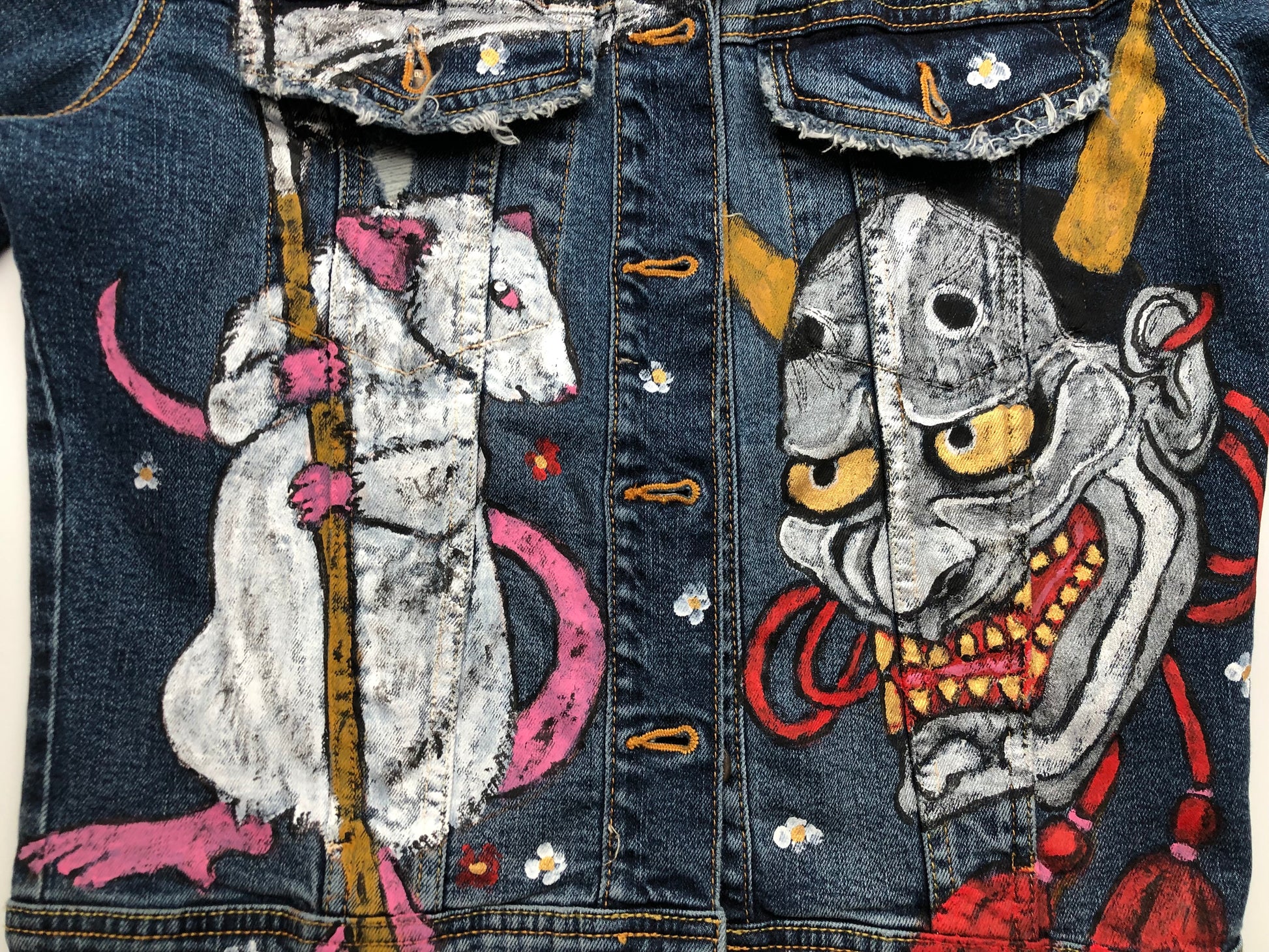 Detail drawing on a women's denim jacket front side