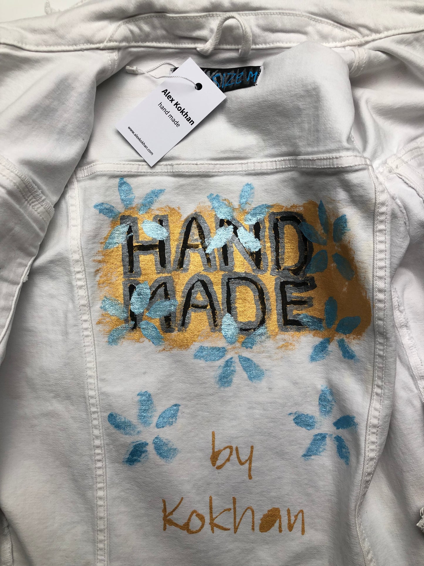 Painting on the inside of a women's denim jacket