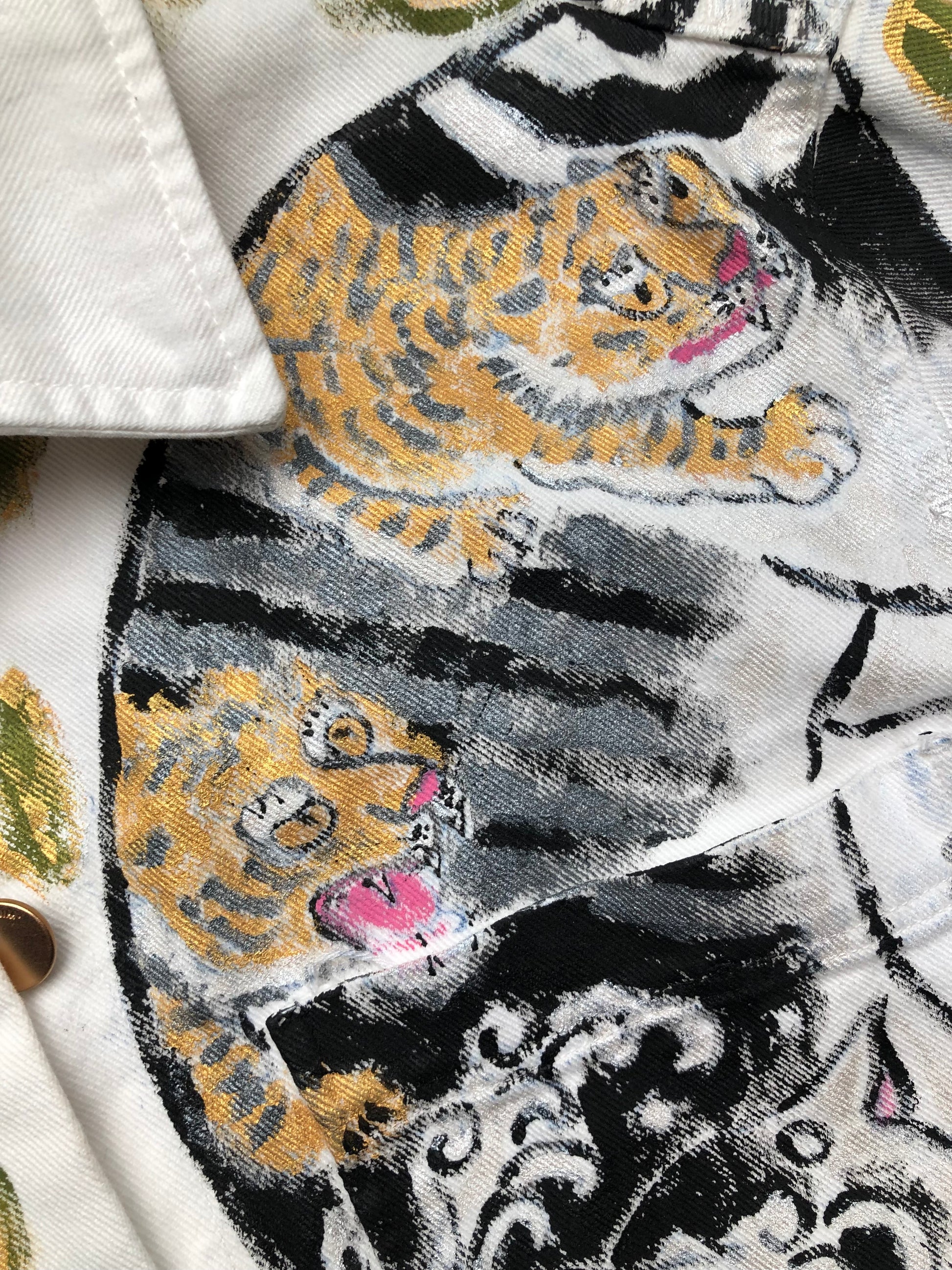 Tigers in detail on a women's denim jacket