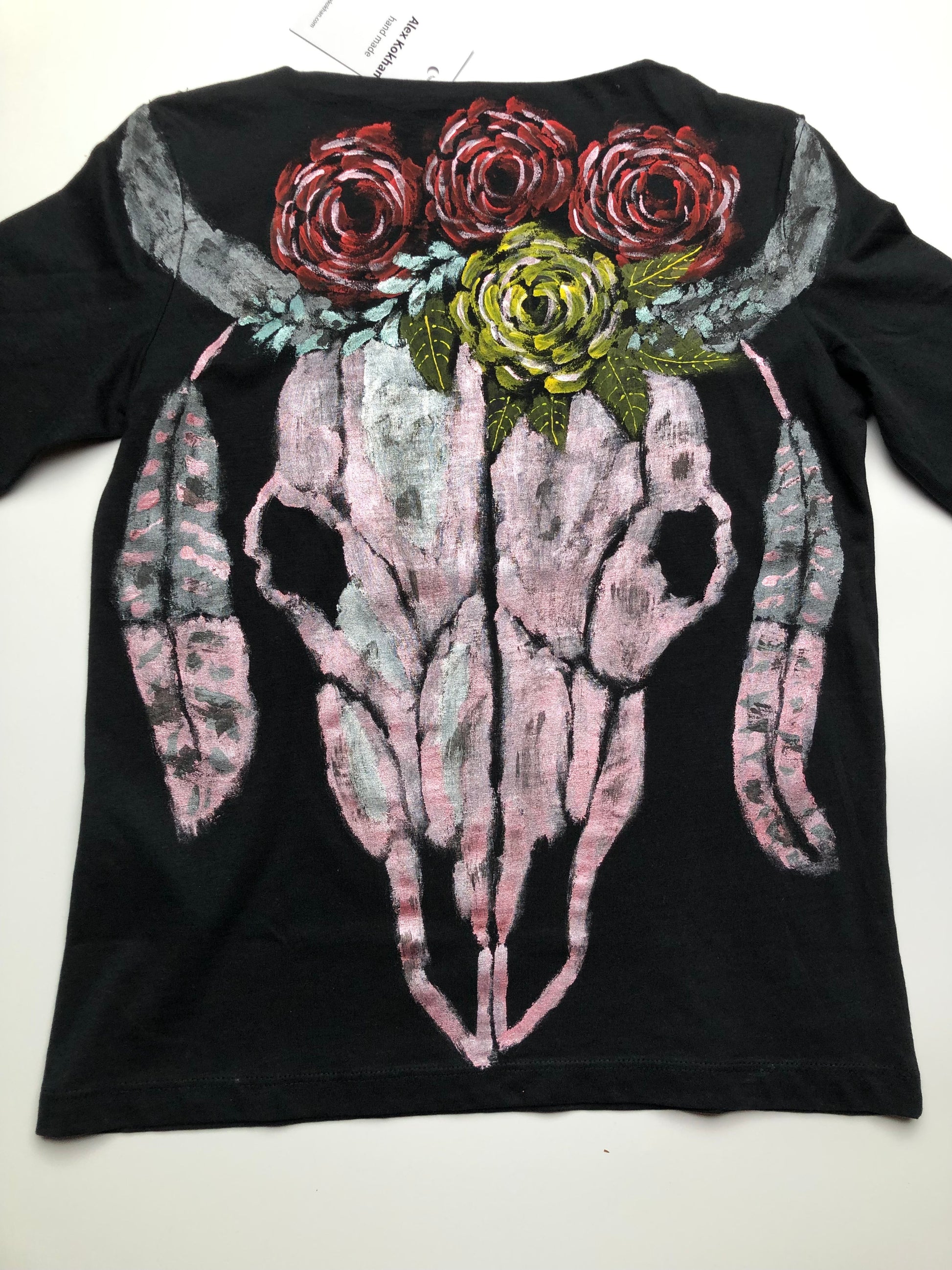 Women's long sleeve black T-shirt with a pattern of a skull, horns, feathers and flowers. Skull Blouse for Ladies