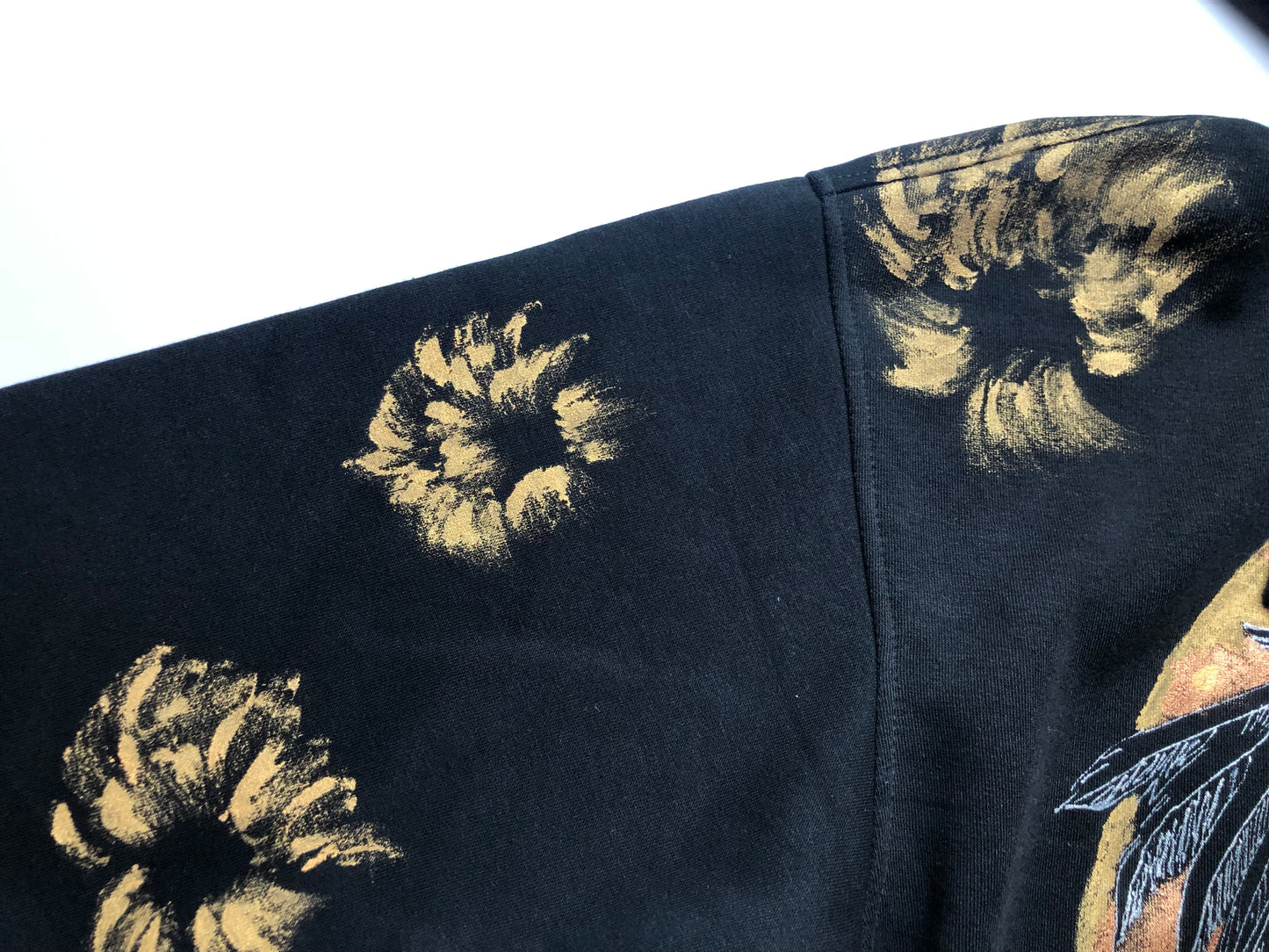 Women's hoodie black gold patterns on the sleeves details