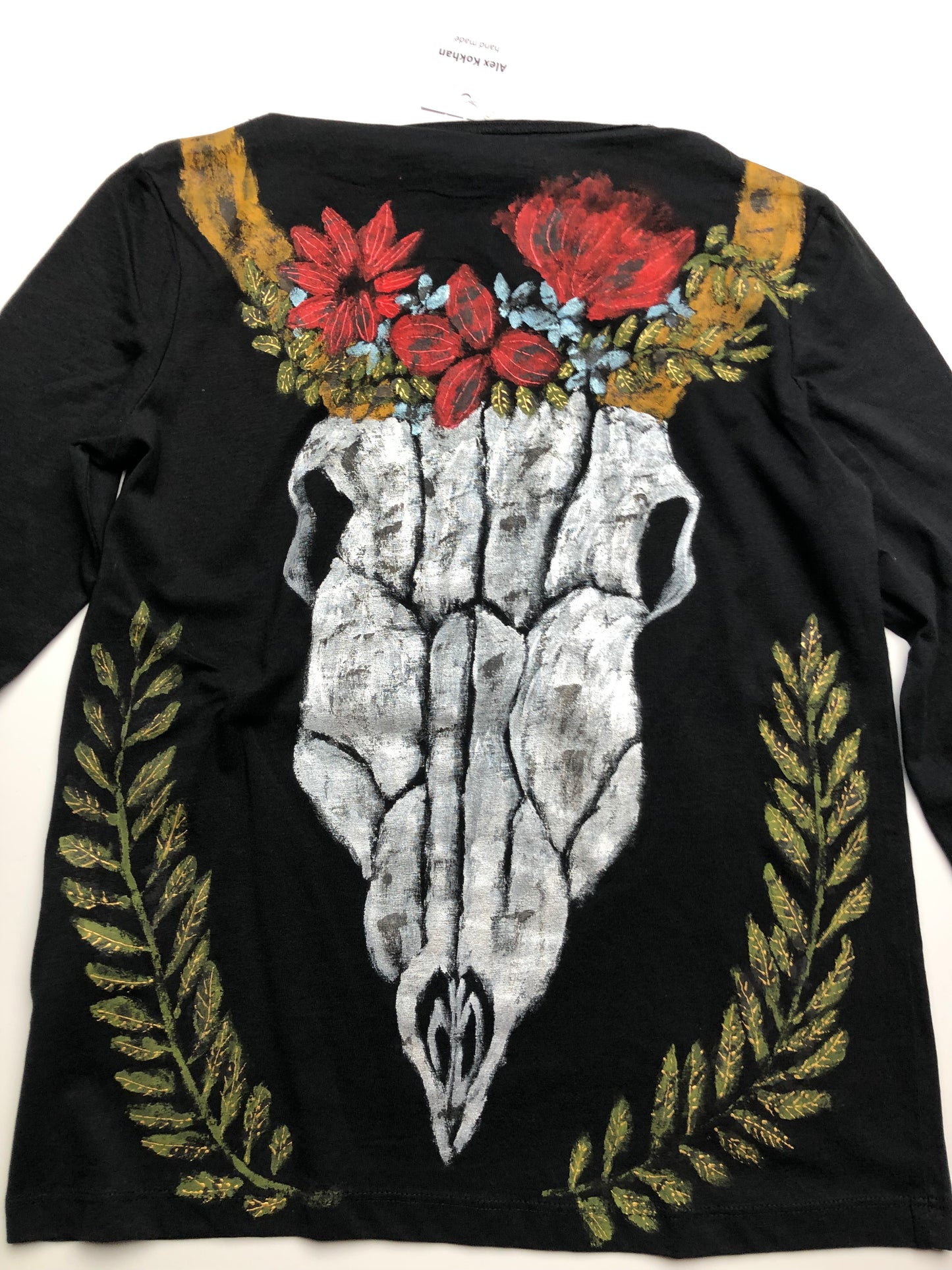 Luxury Women's long sleeve black T-shirt with a pattern of a skull, horns, leaves and flowers. Skull Blouse for Ladies
