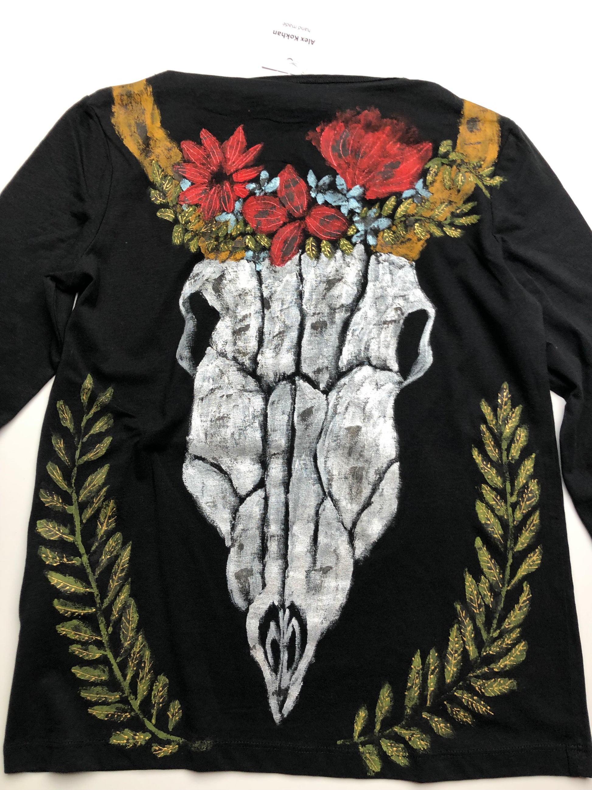 Luxury Women's long sleeve black T-shirt with a pattern of a skull, horns, leaves and flowers. Skull Blouse for Ladies