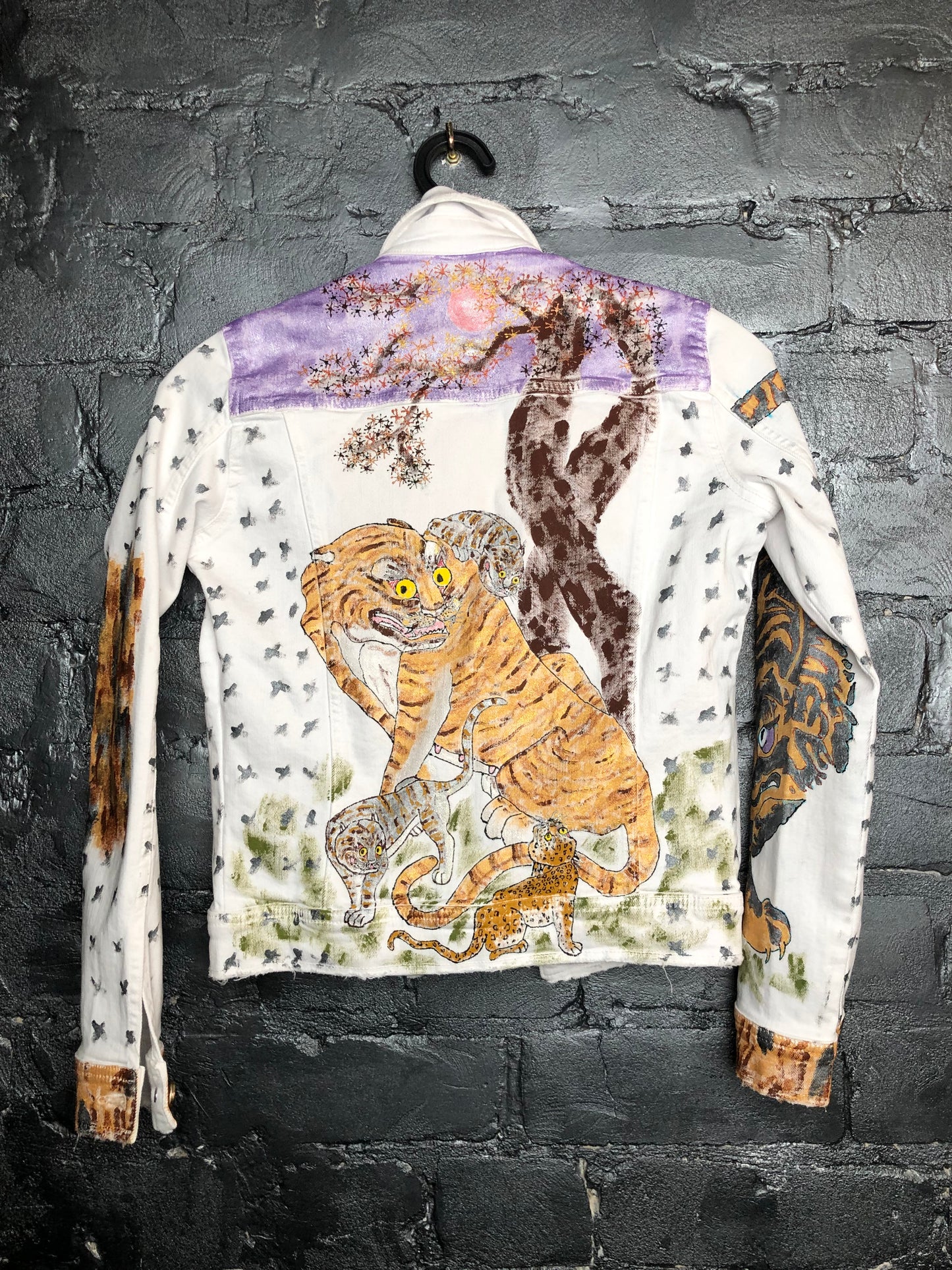 Very stylish women's denim jacket with tiger back