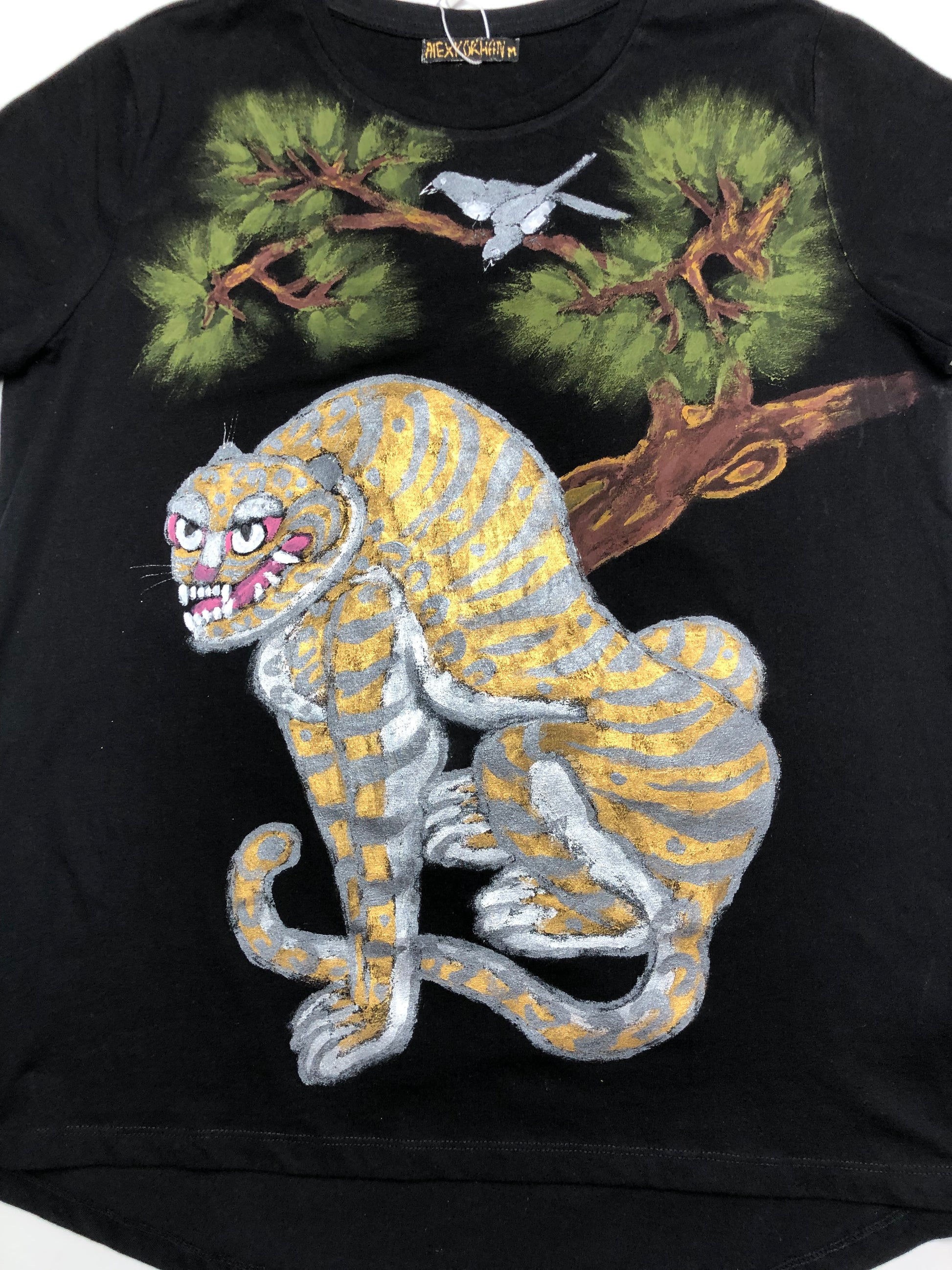 Women's short sleeve t-shirt fanged tiger design details of hand painted tiger muzzle, bird and tree