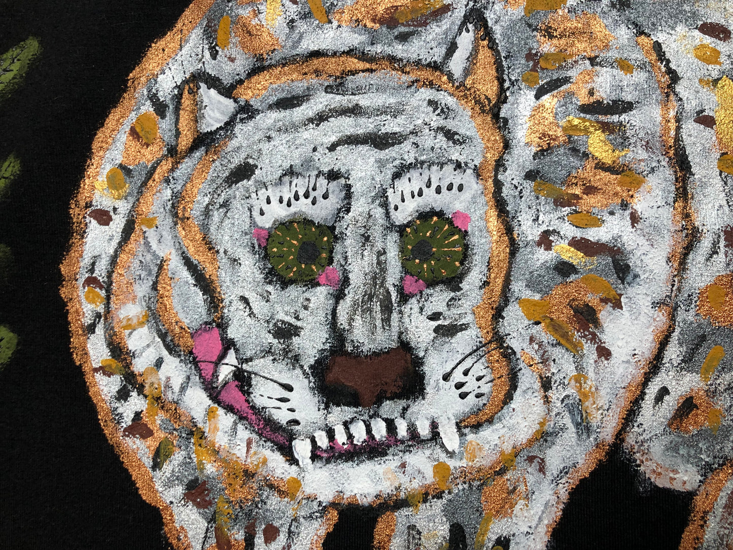 Detailed eyes of a tiger on a women's black sweatshirt