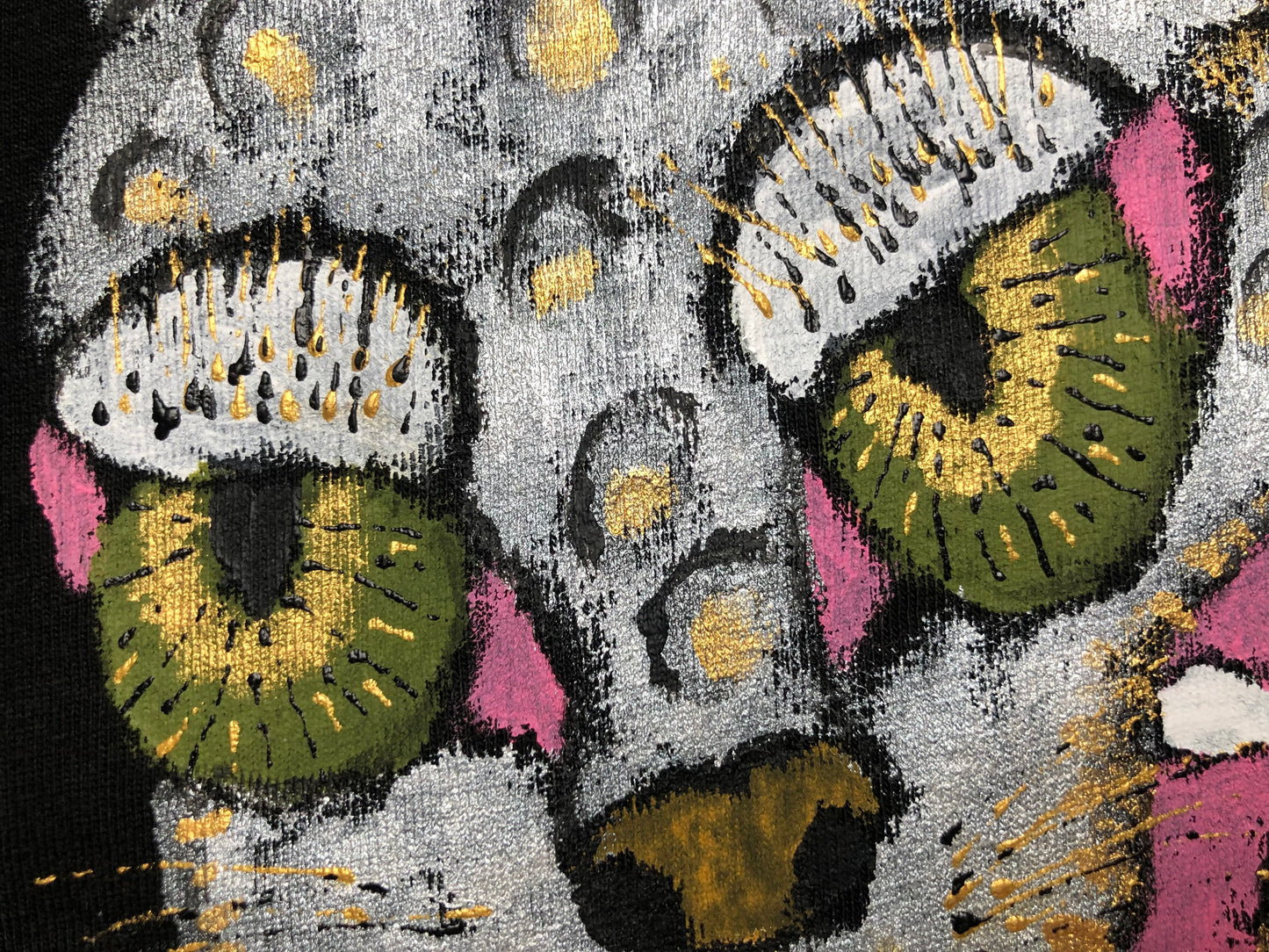 Green eyes of a leopard on a T-shirt in detail