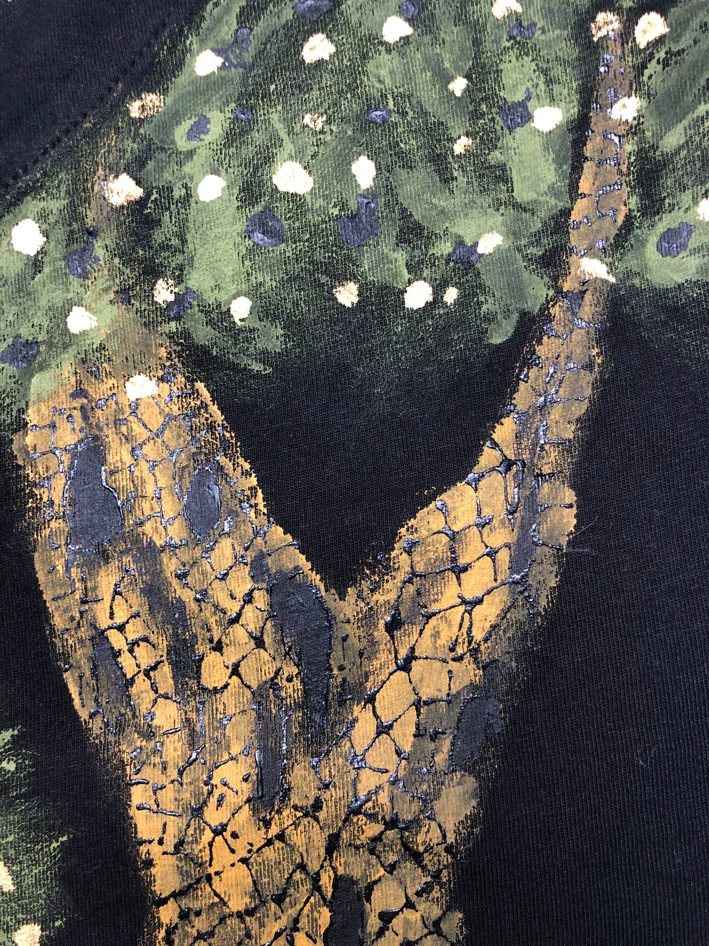 Detailed tree bark with green foliage in an exquisite pattern on a women's t-shirt