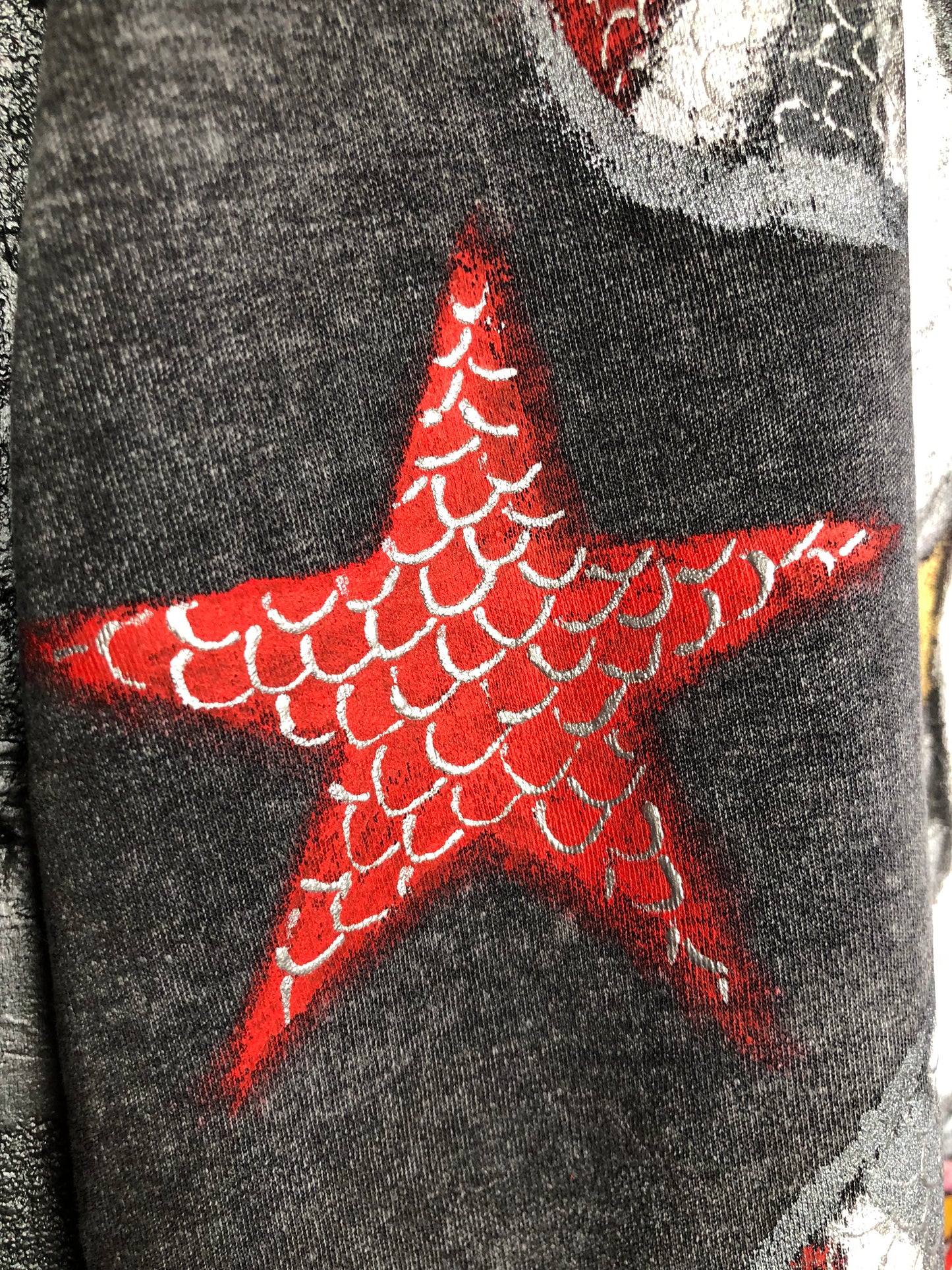 Detailed red star with a painting on a t-shirt